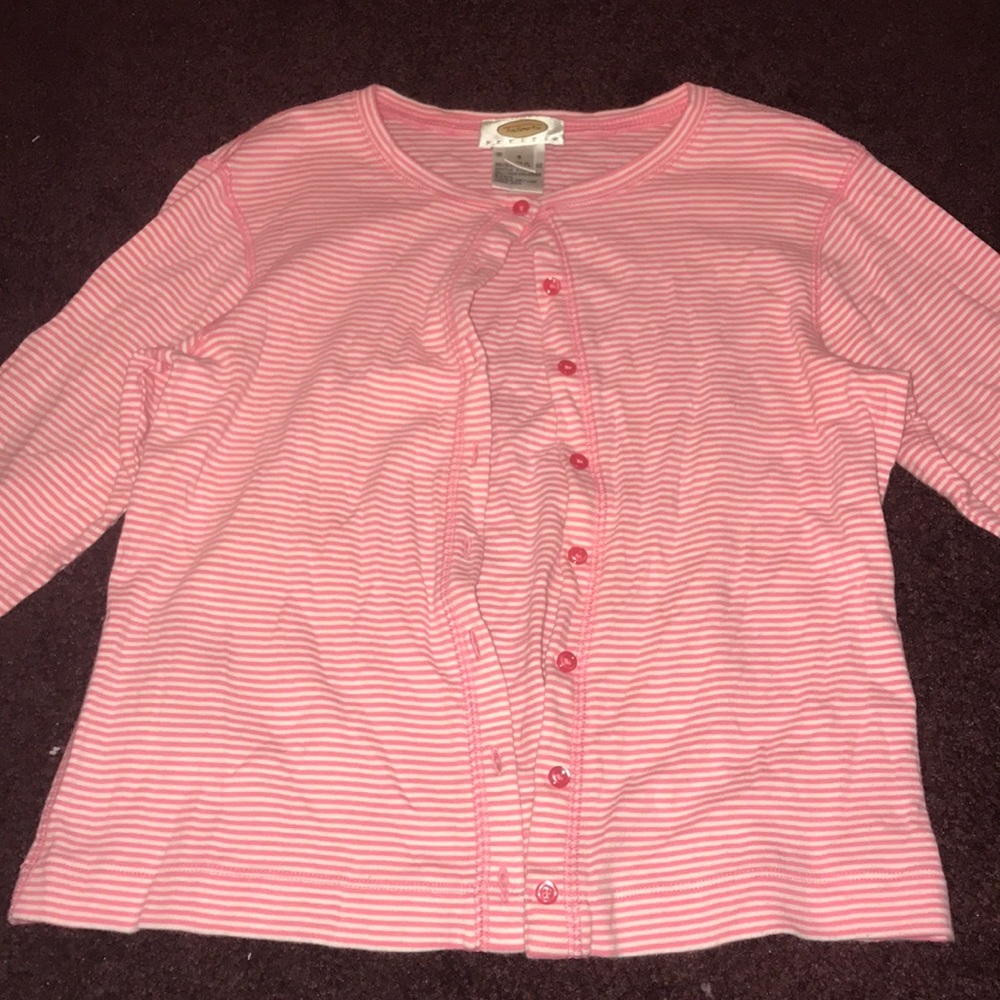 A white and pink striped sweater